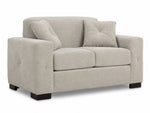 Valetta Loveseat - Ivory angled view with two seat cushions, wide track arms, dark block feet and two matching accent pillows